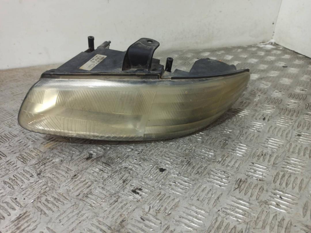 фара левая Chrysler Voyager 3 поколение 1998 - фото №1